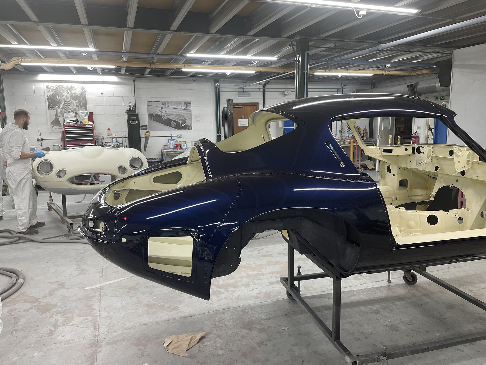 Build process — body shell on a rolling stand in the workshop