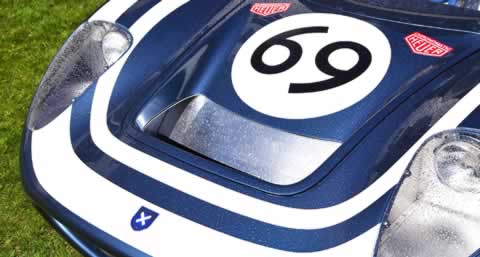 The LM69 front close-up — number 69 roundel and Heuer badges