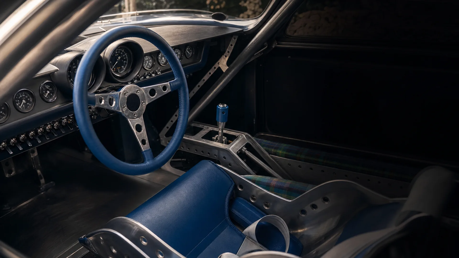 The LM69 cockpit — blue wheel, gauges and toggles