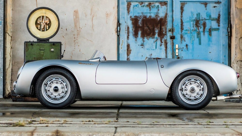 The 550 outside the workshop with a period petrol pump
